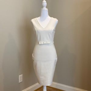 White Sleeveless V-Neck, Form-Fitting Dress with Bow Detail at Waistline